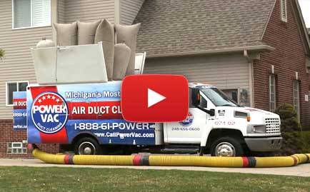 A Power Vac duct cleaning truck outside of a home during a duct cleaning.